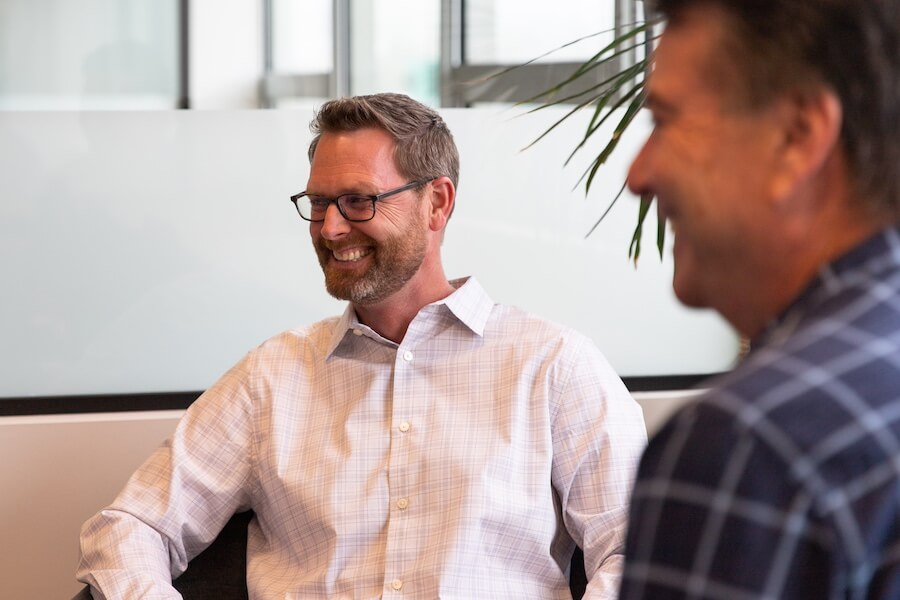 The Verb Biotics team smiles while meeting to discuss 